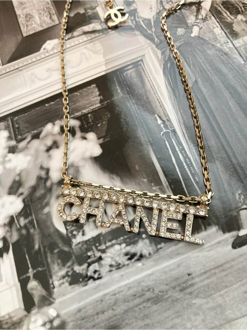 CHANEL Gold and Clear Crystal Logo Necklace